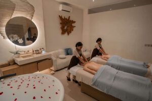 Guest relaxing during a massage ubud session at Jaens Spa with warm oil and soft candlelight in a serene treatment room