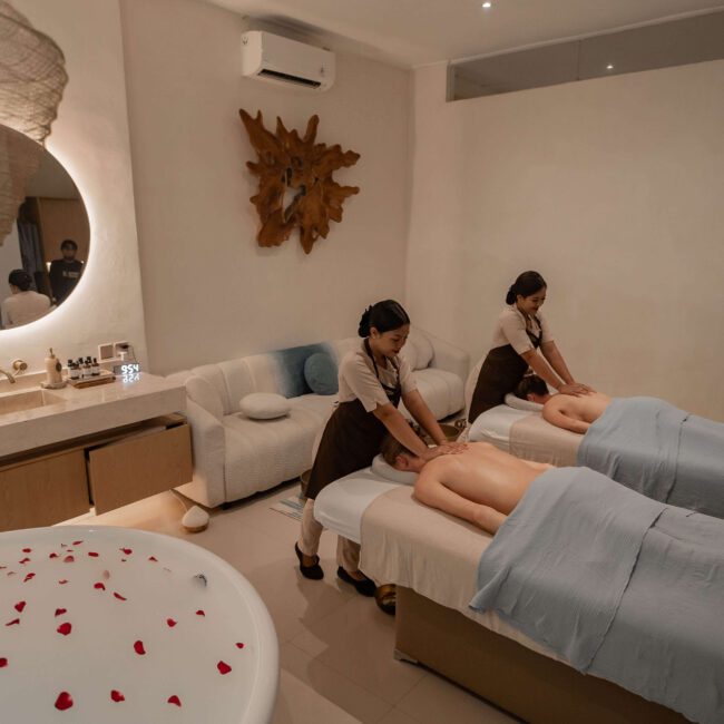 Guest relaxing during a massage ubud session at Jaens Spa with warm oil and soft candlelight in a serene treatment room