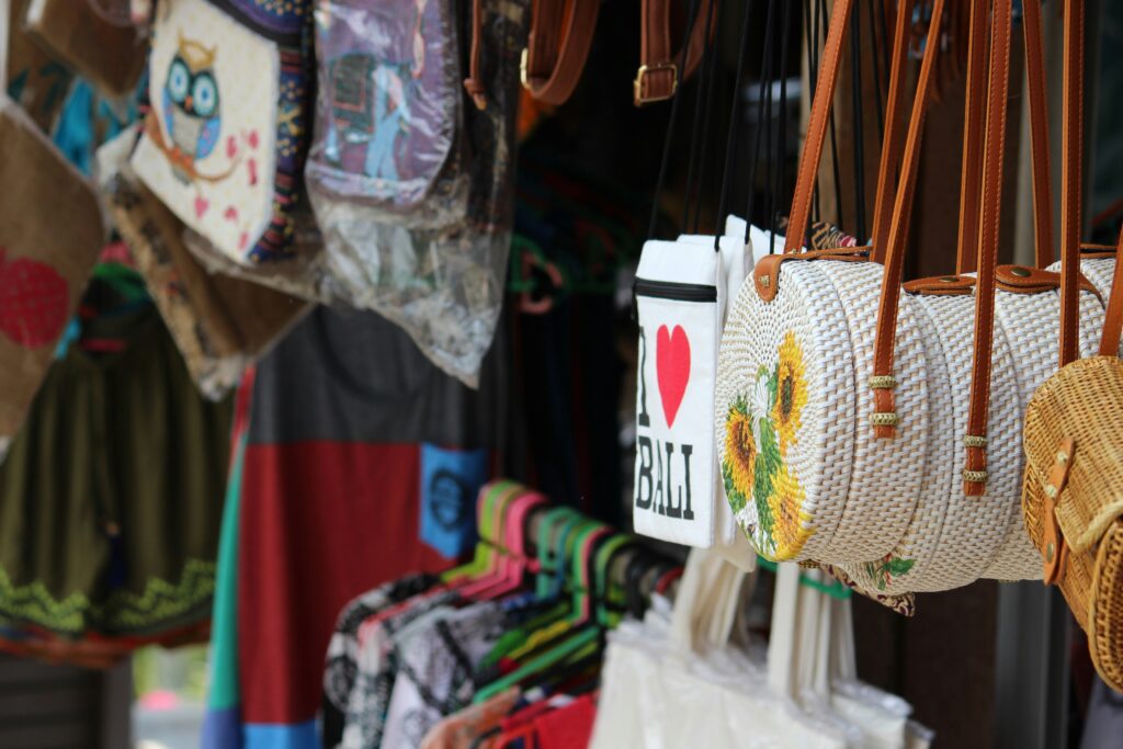 Hand-woven rattan bags and local handicrafts on display at a stall in the Ubud Art Market