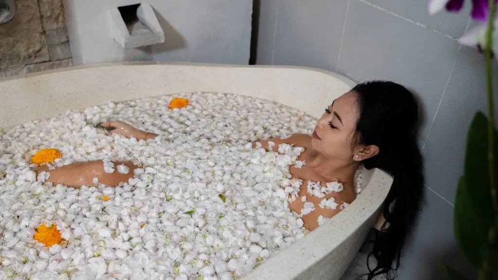 Relaxing spa bath with tropical flowers