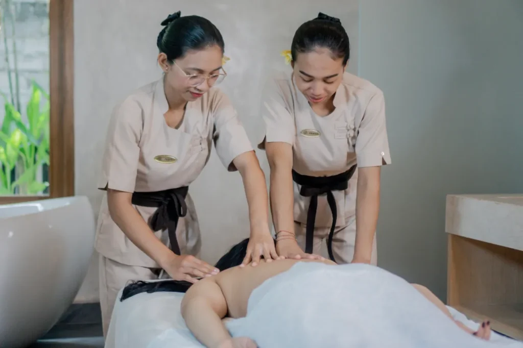 Coordinated Balinese massage movements by two professional therapists