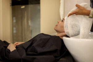 Traveler receiving hair treatment at Jaens Spa